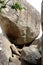 A boy trapped between big rocks before reaching the top of Pidurangala Rock to see Sigiriya