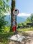 Boy traveler is standing near the sign of caution bears