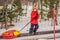 Boy with tubing rises on a travelator to the mountain. Child having fun on snow tube. Boy is riding a tubing. Winter fun