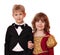 Boy in tuxedo and little girl in golden dress