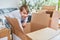 Boy unpacks a moving box