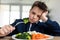 Boy unsatisfied with vegetable lunch