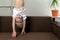 Boy is upside down over sofa. Funny child hangs upside down