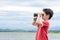 Boy using binoculars near