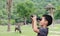 Boy using binoculars in zoo