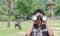 Boy using binoculars in zoo
