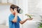 Boy with VR glasses projects a dinosaur on his arm