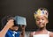 Boy with VR Headset and girl with crown in front of blackboard