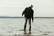 Boy wading in water moving in during high tide