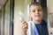 Boy in wagon of train with tooth-paste and brush