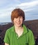 Boy walking in volcanic area