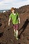 Boy walking in volcanic area