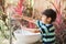 Boy washing hand at toilet park outdoor