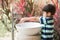 Boy washing hand at toilet park outdoor