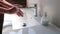 Boy washing his hands with soap to prevent coronavirus pandemic infection