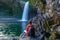 Boy watching the Bassin La Paix waterfall in Reunion Island