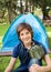 Boy With Water Bottle At Campsite