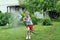 Boy watering lawn with hose