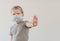 Boy wearing facial disposable mask. Stop coronavirus