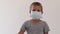 Boy wearing facial disposable mask. Stop coronavirus