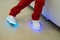 Boy wearing glowing white led sneakers