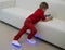 Boy wearing glowing white led sneakers