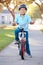 Boy Wearing Safety Helmet Riding Bike