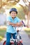 Boy Wearing Safety Helmet Riding Bike