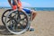 Boy on the wheelchair on the beach