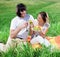 Boy with wineglass and girl with fruits