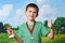 Boy winner with cup and medal on nature