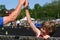 Boy wins race, congratulated by coach