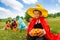 Boy in wizard costume holds Halloween pumpkin