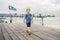 Boy on Wooden bridge Clan Tan Jetty in George Town, Penang