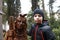 Boy with wooden sculpture of Baba Yaga