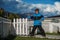 Boy in the yard of a country house in autumn