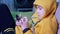 Boy in Yellow Hoody sits on Sofa, Looking Messages, Play on Smartphone at Home