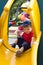 Boy in yellow slide