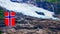 Boyabreen Glacier and norwegian flag