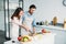 boyfriend cutting onion and crying girlfriend