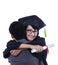 Boyfriend hug girlfriend on graduation - isolated