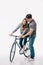 boyfriend teaching girlfriend ride bicycle