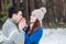 Boyfriend warms hands sweetheart, frozen in the cold