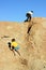 Boys climbing on rocks