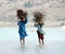 Boys crossing the salt water lake in Thar desert of Sindh Pakistan.