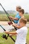 Boys fishing with grandpa