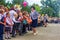 Boys and girls are enrolled in first grade and receive gifts from high school students on the solemn line at the school on Knowled