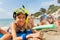 Boys and girls in scuba masks on the beach