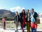 Boys and girls with senior citizen in front of Annapurna mountain in Mustang district of Nepal