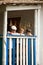 Boys happy on the porch of an old house